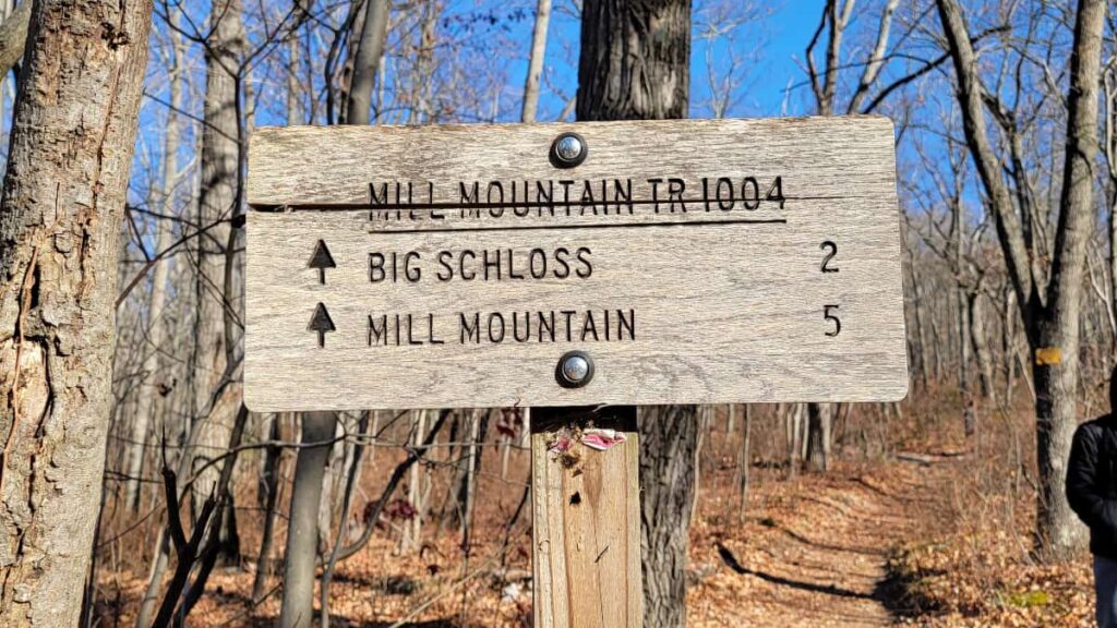Mill Mountain Trail sign that states "Big Schloss 2" and "Mill Mountain 5"