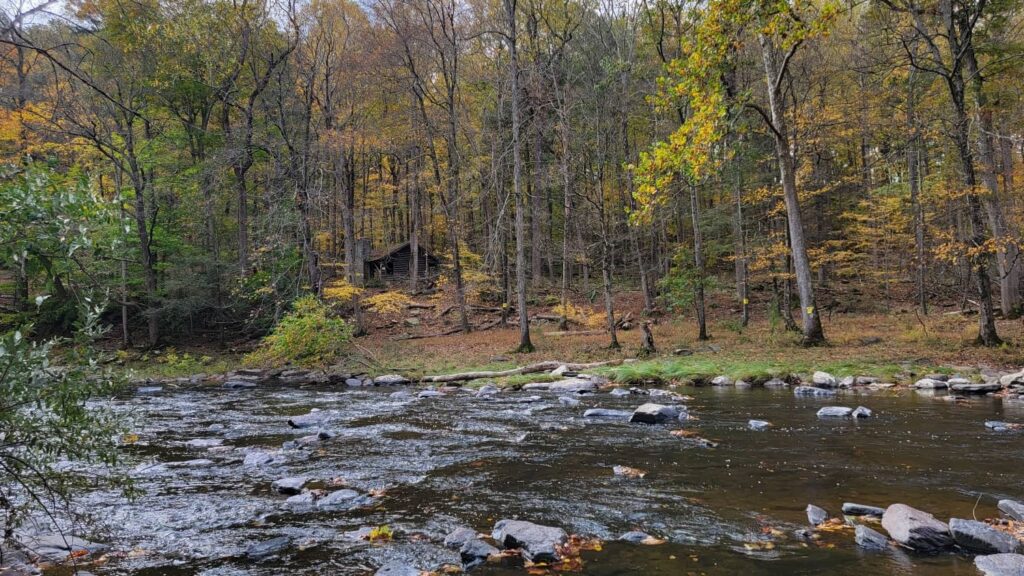 On the banks of Tohickon Creek with a view of an old cabin across