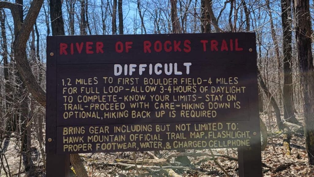 Sign reads "River of Rocks Trail: Difficult"
