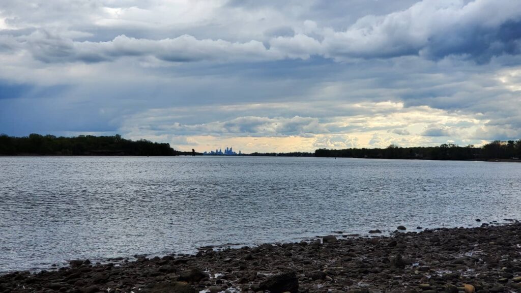 The Philadelphia skyline is seen in the distance with the Delaware River in the foreground