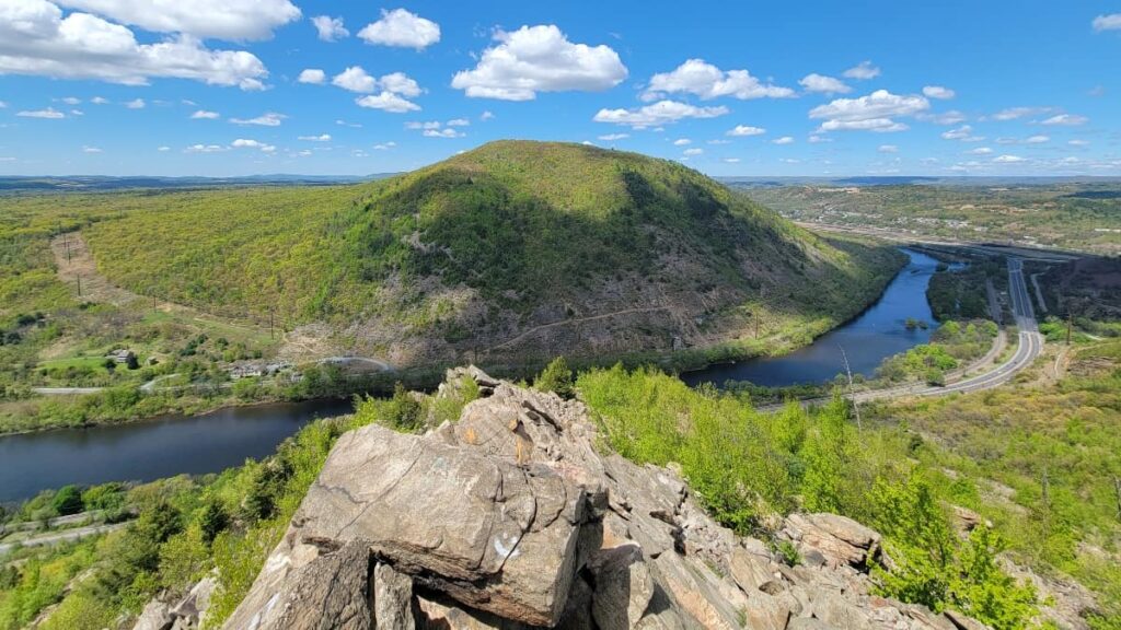 Looking towards the Lehigh River from the top of the Lehigh Gap East Loop. Rocks are jutting up in the foreground