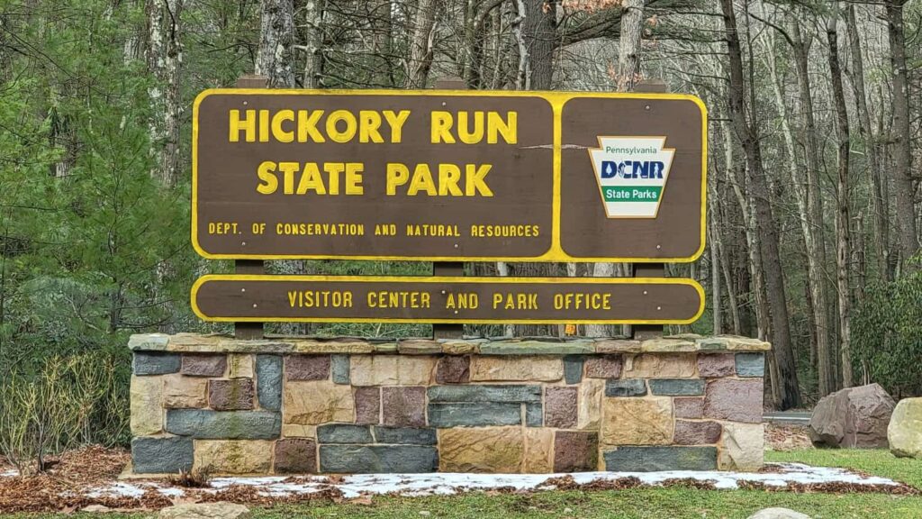 Brown sign with yellow writing that states "Hickory Run State Park Visitor Center and Park Office"
