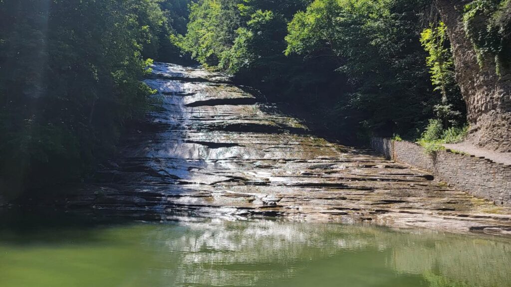 Buttermilk Falls is a cascading waterfall with natural pool at the bottom