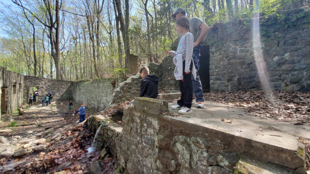 people stand inside ruins