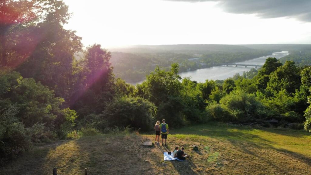 aerial view of a family standing looking out towards the delaware river