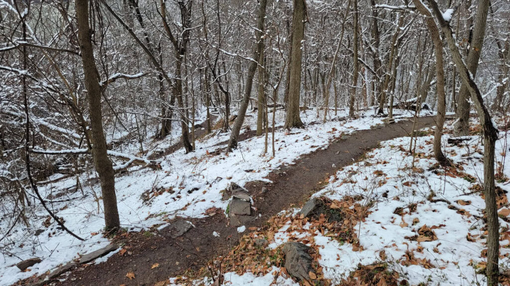 snow on either side of the trail makes the switchbacks obvious