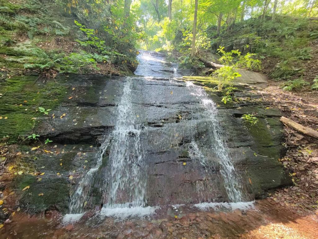 Water cascades over rocks at Laurel Falls in Worthington State Forest