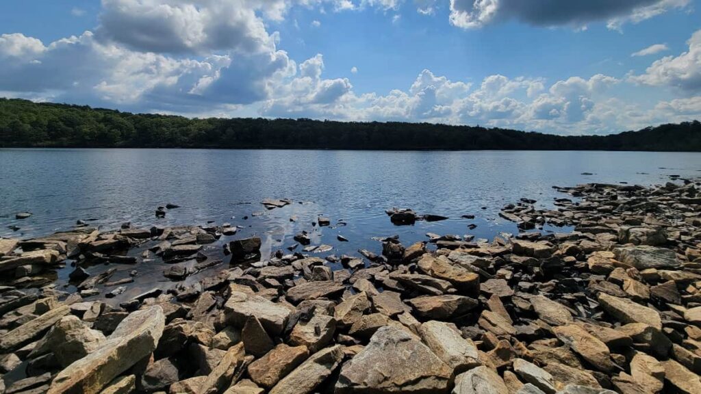 View of Sunfish Pond along a rocky beach