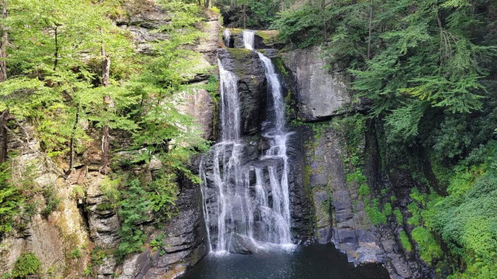 View of the 100 foot waterfall at Bushkill Falls in the summer
