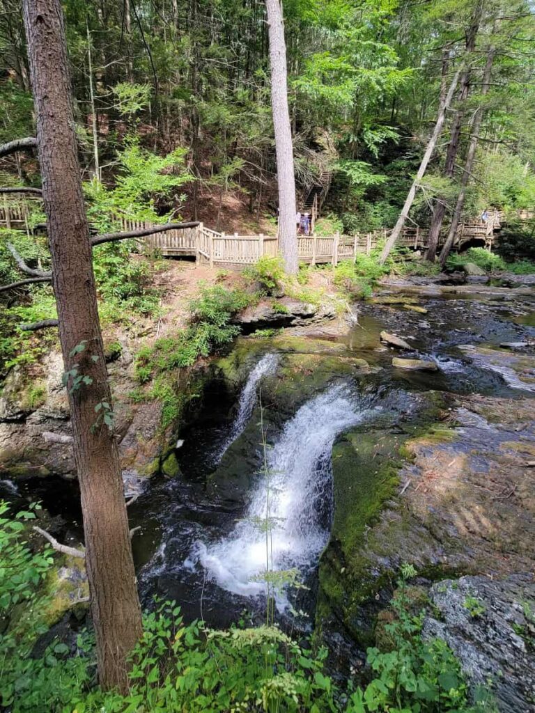 view of the short waterfall at the top of the Main Falls in Bushkill Falls