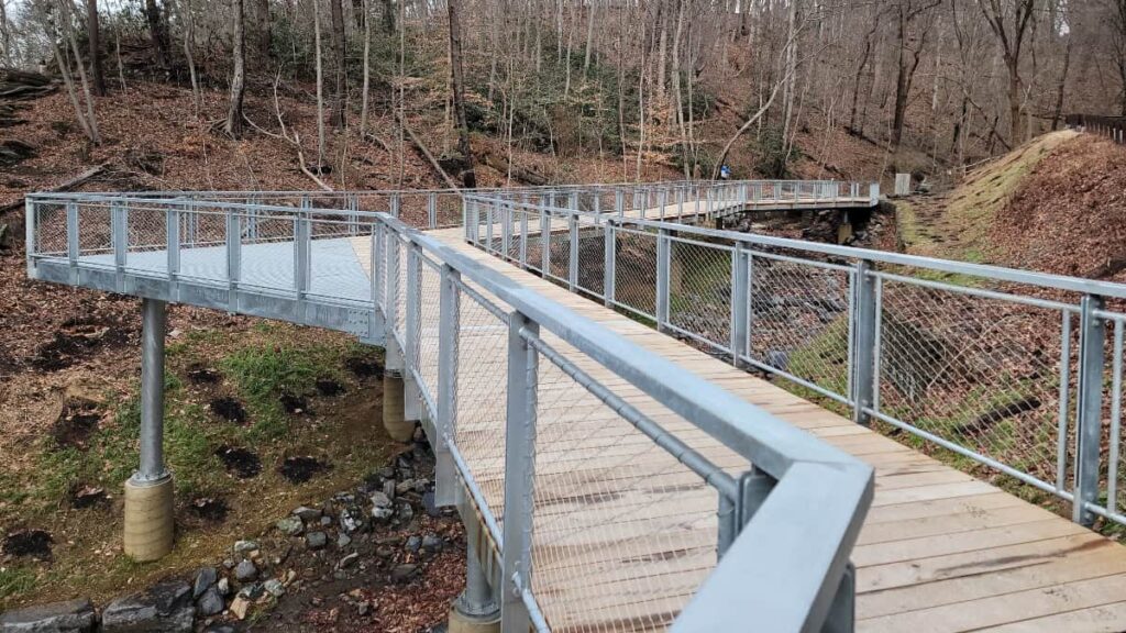 a wooden boardwalk overlook and pedestrian walkway in Wissahickon