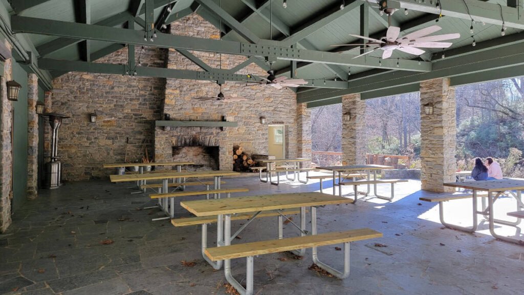 pincic tables sit under a covered patio at Natural Bridge