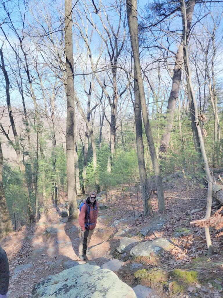 Looking down the trail at a man and you can see the steep grade of the trail