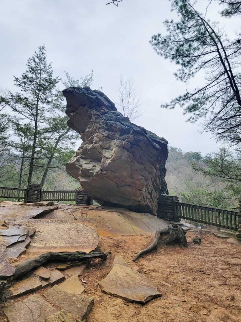 A large boulder is balanced on the edge of a gorge above Great Trough Creek