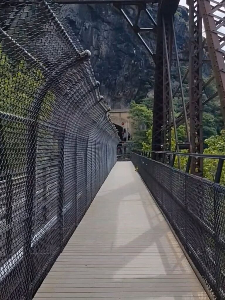 Crossing the Potomac River along a train bridge that leads to the Maryland Heights Trail from Harpers Ferry
