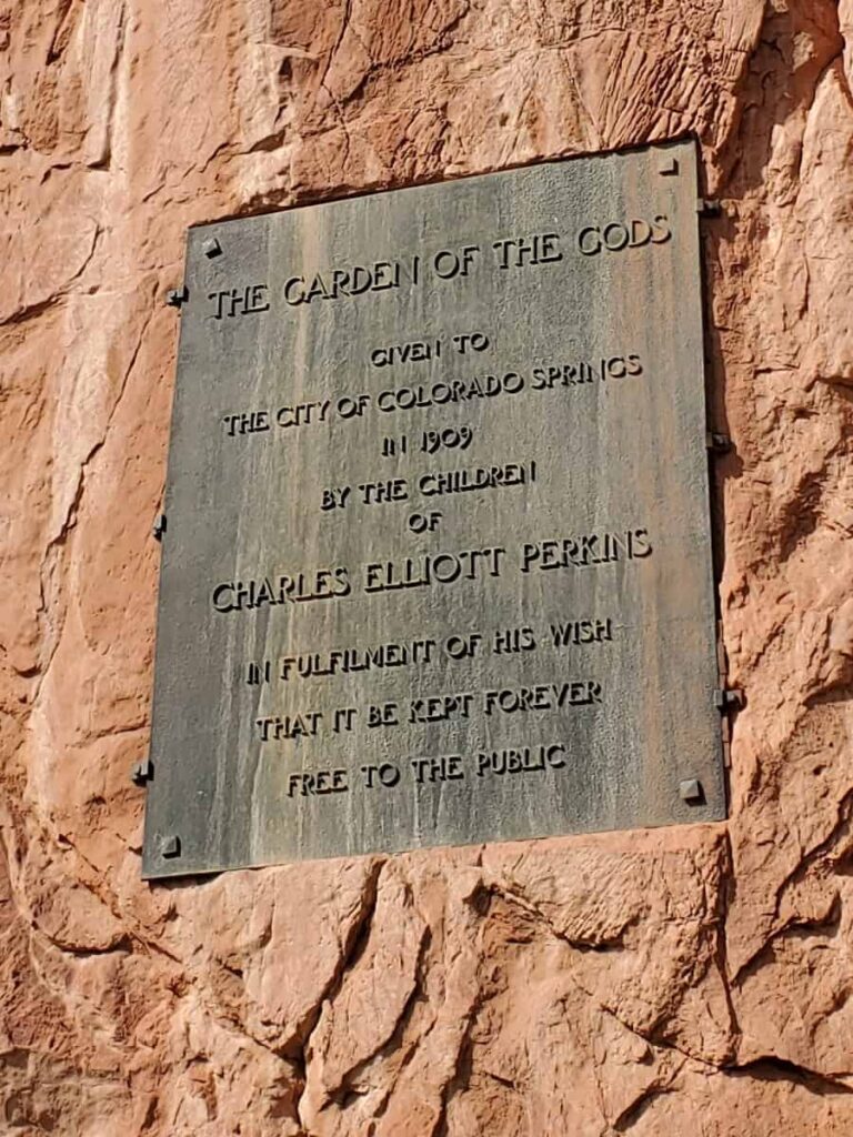 A plaque on a rock dedicates Garden of the Gods to the people of Colorado Springs