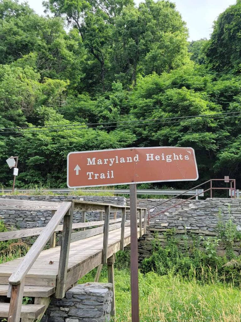 A sign along the C&O Canal Towpath directs hikers to the Maryland Heights Trail