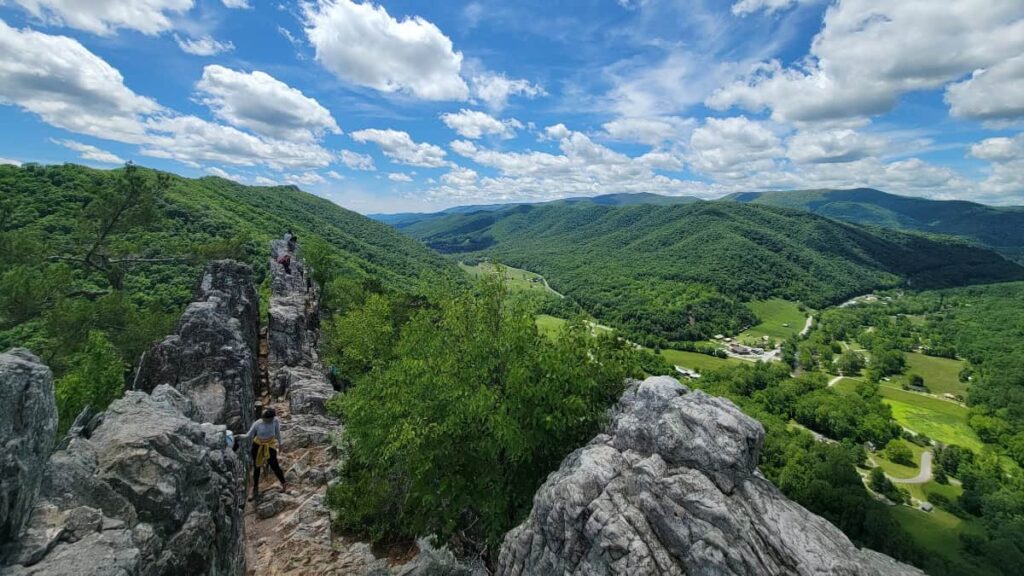 Looking south at Seneca Rocks at hikers climbing on the cliffs