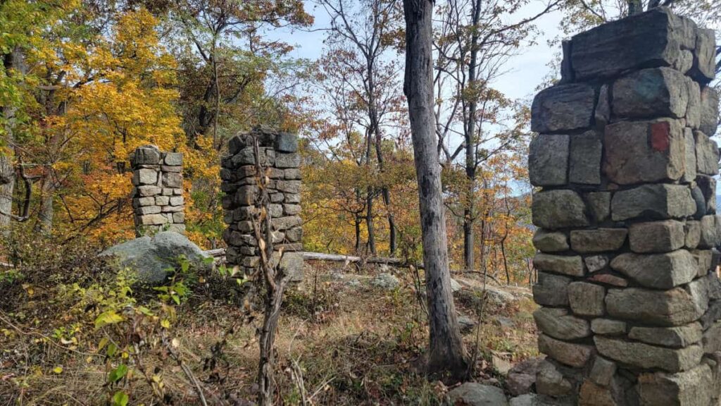Stone pillar ruins are seen along a hiking trail at Storm King State Park