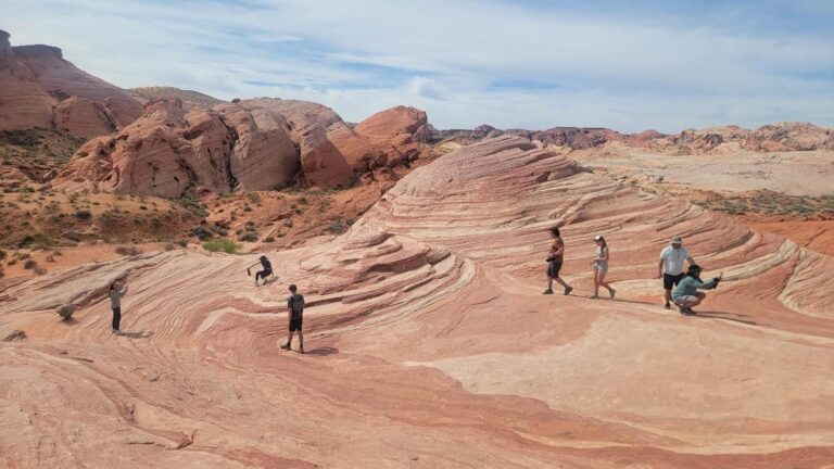 People walk on the Fire Wave at Valley of Fire State Park