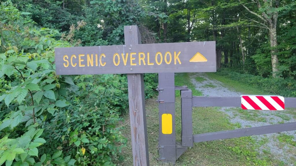 A sign points visitors towards the scenic overlook