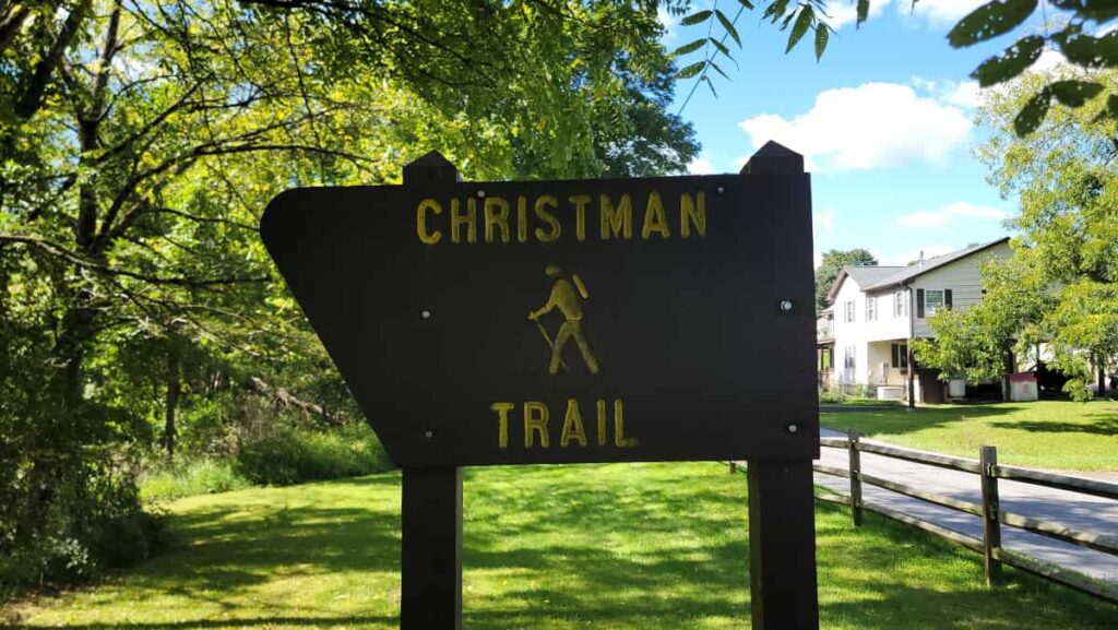 A sign reads "Christman Trail"